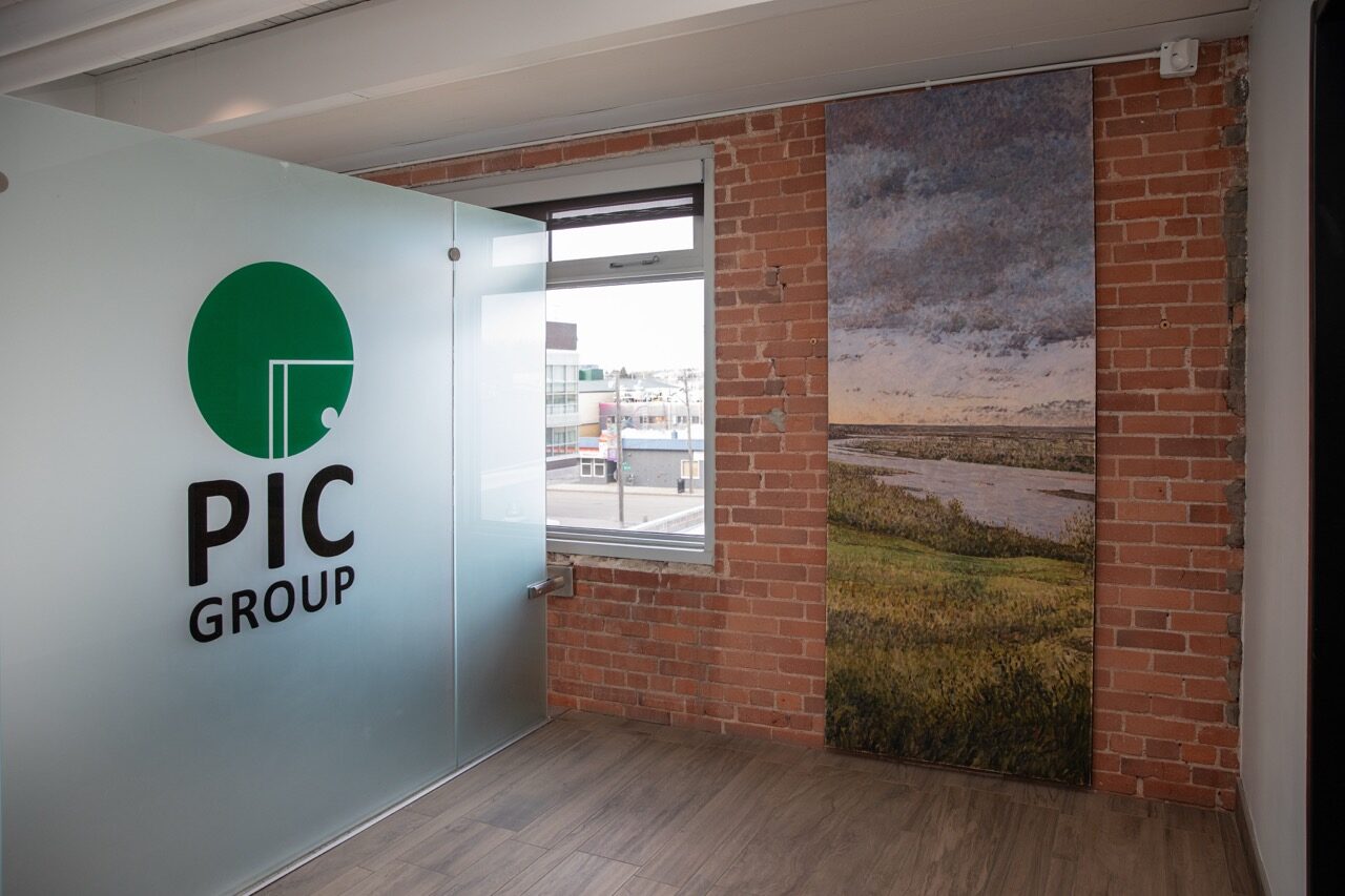 PIC logo wall inside the office